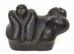 Peggy Qablunaaq Aittauq (1938-), Qamani'tuaq (Baker Lake)<untitled (smiling ink accompanied by two spirits), early 1970's, stone, 3.5 x 5.5 x 3.5 in. 